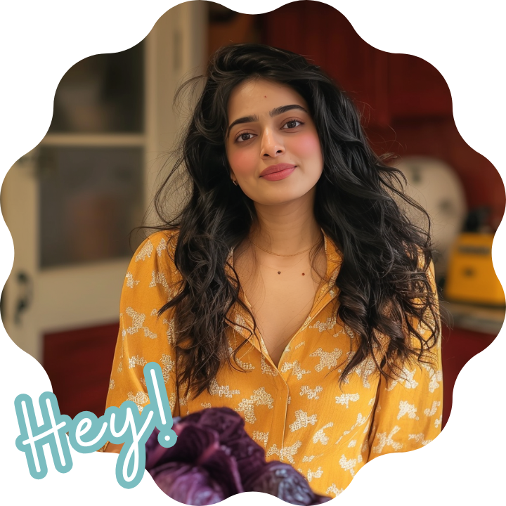 A portrait of Emily standing in a cozy kitchen, smiling and looking relaxed, with soft lighting illuminating her long, wavy hair and casual black sweater.